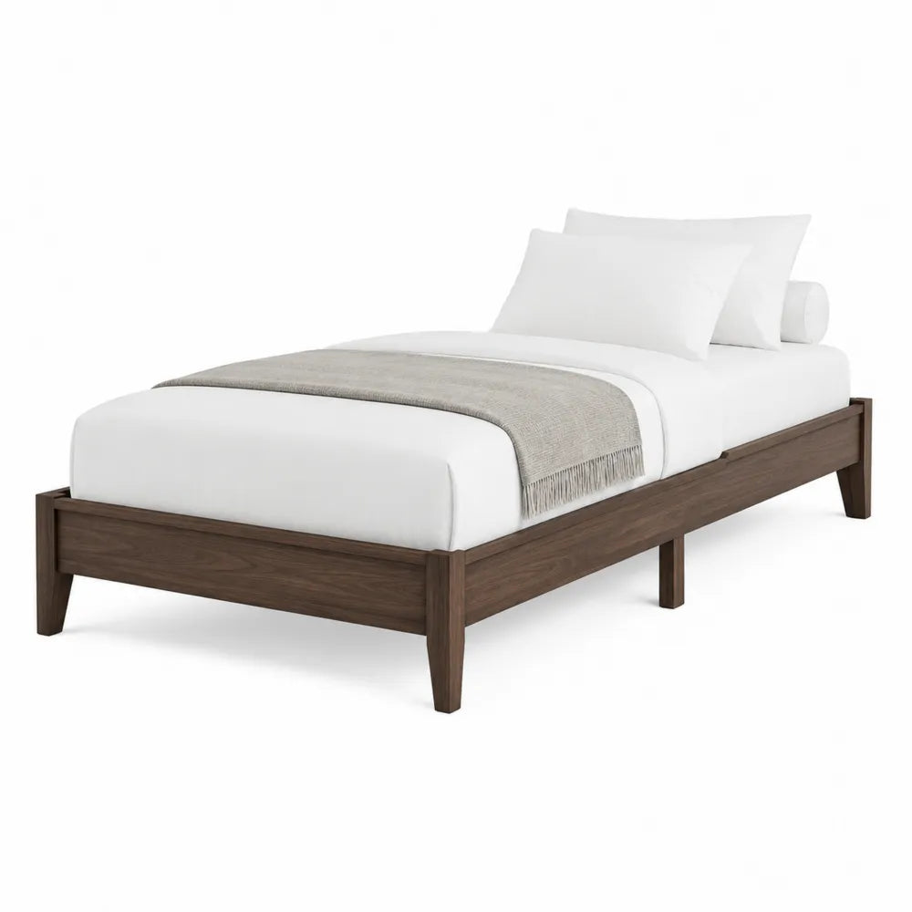 Cama individual de madera con colchón blanco